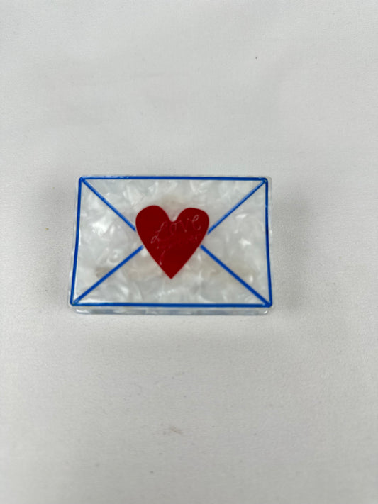 Pinza de Pelo Sobre Carta de Amor