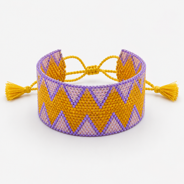 Pulsera Miyuki Extra Ancha con Borlas Malva y Crudo