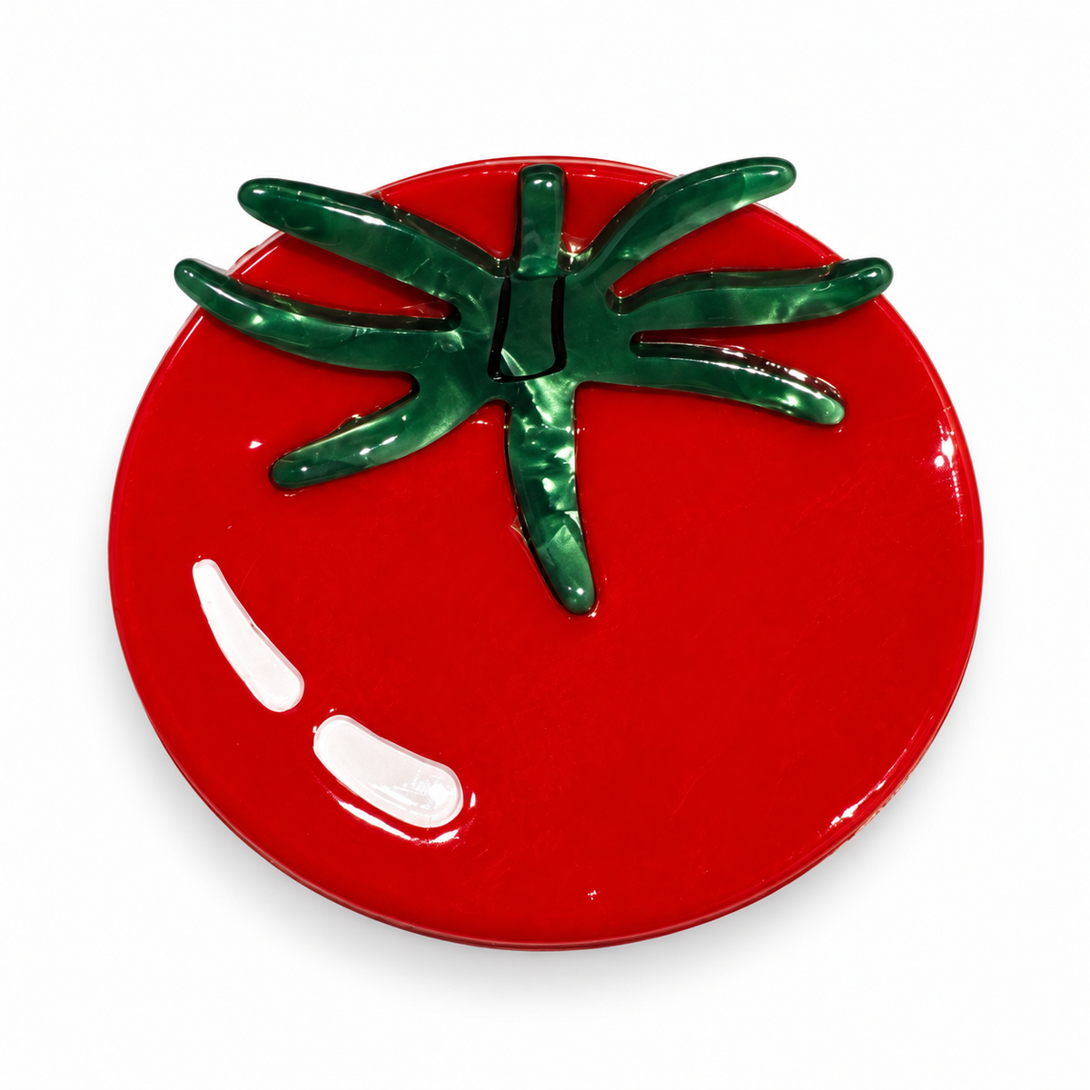 Pinza de pelo tomate sobre fondo blanco