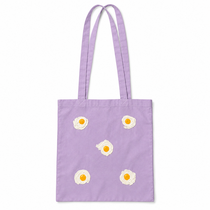 Tote bag Lila con 5 huevos fritos en relieve sobre fondo blanco