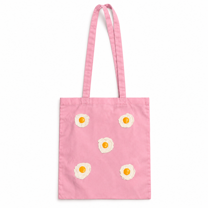 Tote bag Rosa con 5 huevos fritos en relieve sobre fondo blanco
