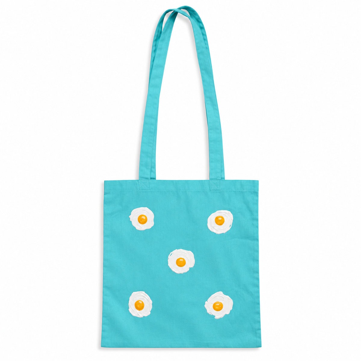 Tote bag Turquesa con 5 huevos fritos en relieve sobre fondo blanco